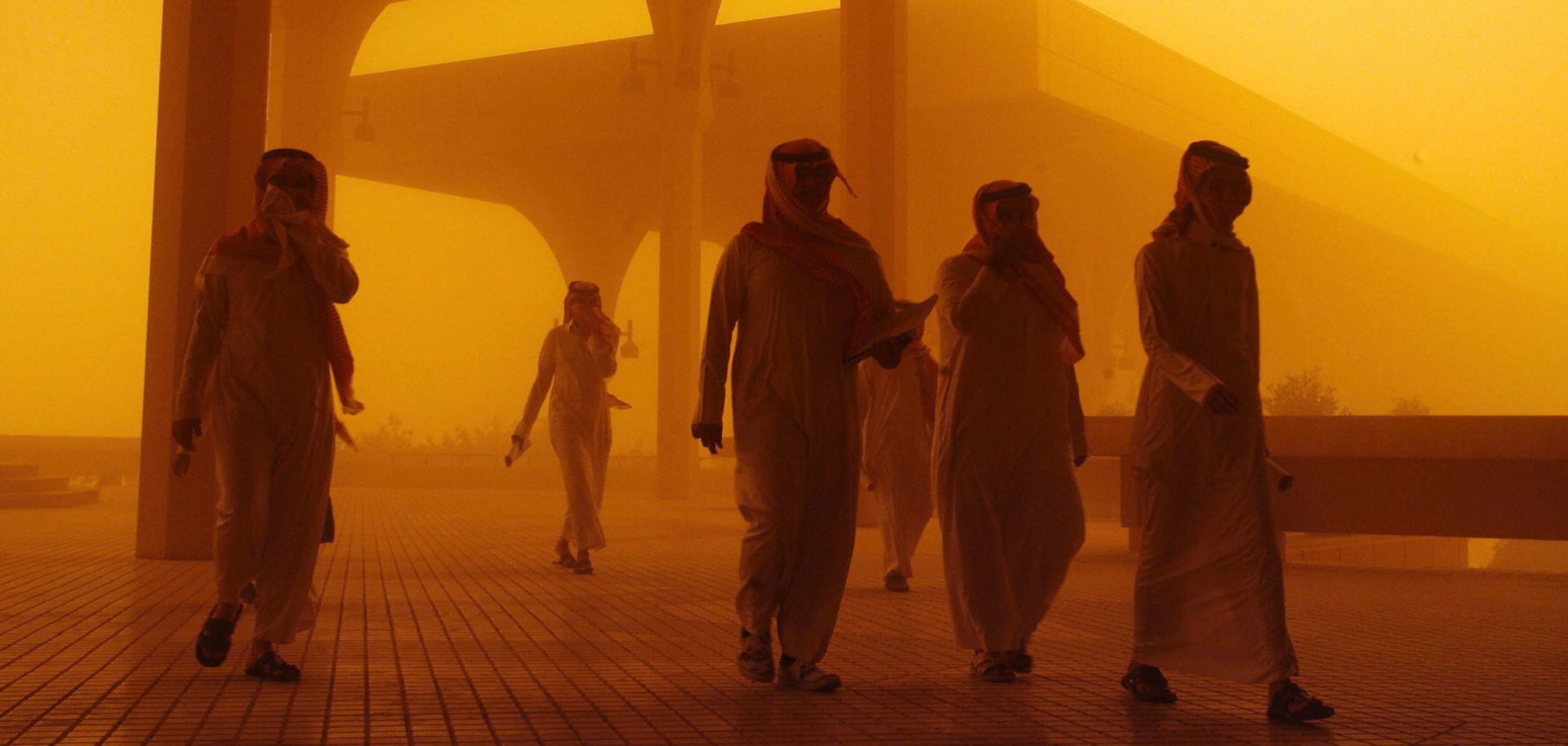Saudi citizens struggle to see the horizon through a punishing sandstorm.