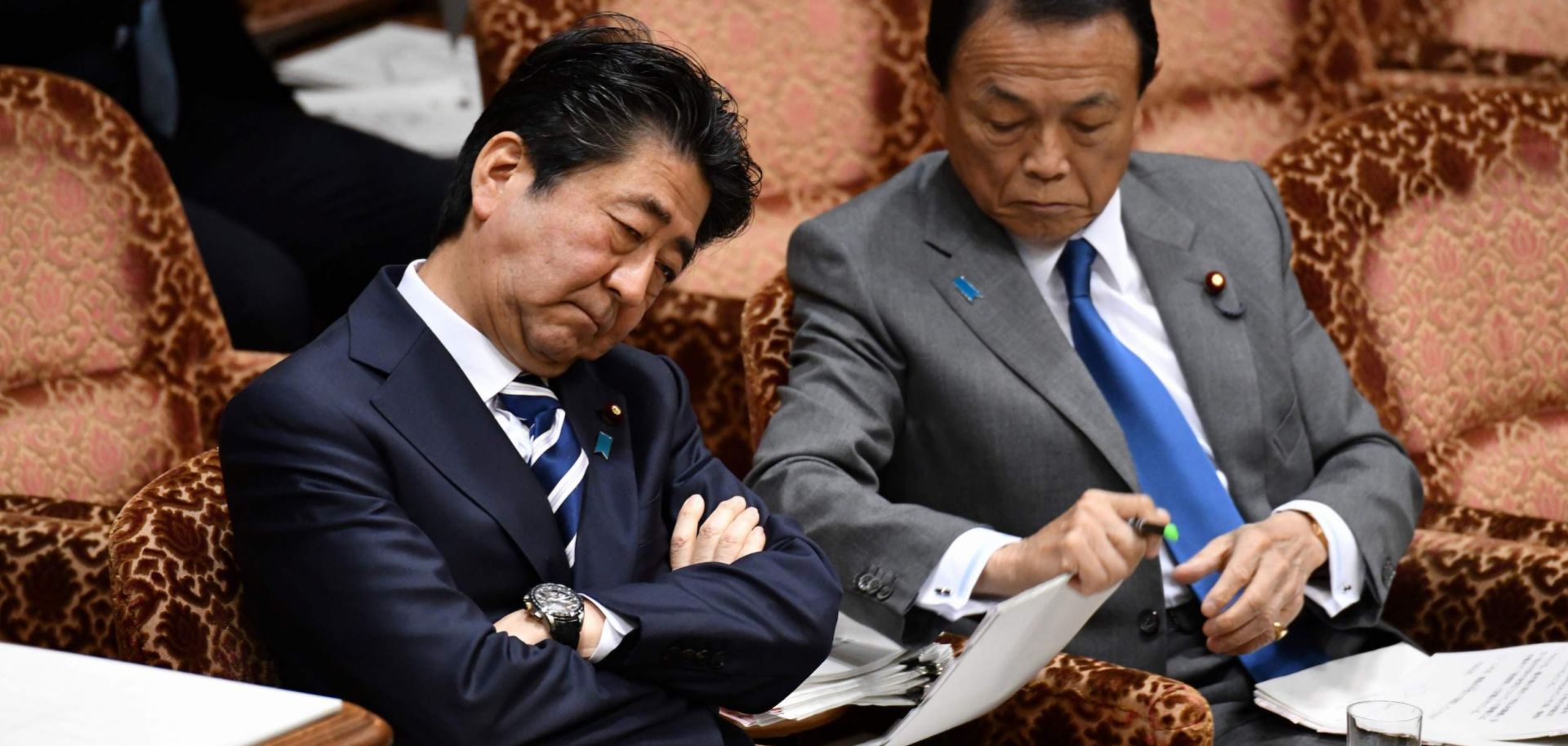 Shinzo Abe (left), prime minister of Japan, and Taro Aso, finance minister, attend a budget committee meeting in Tokyo on March 19, 2018.