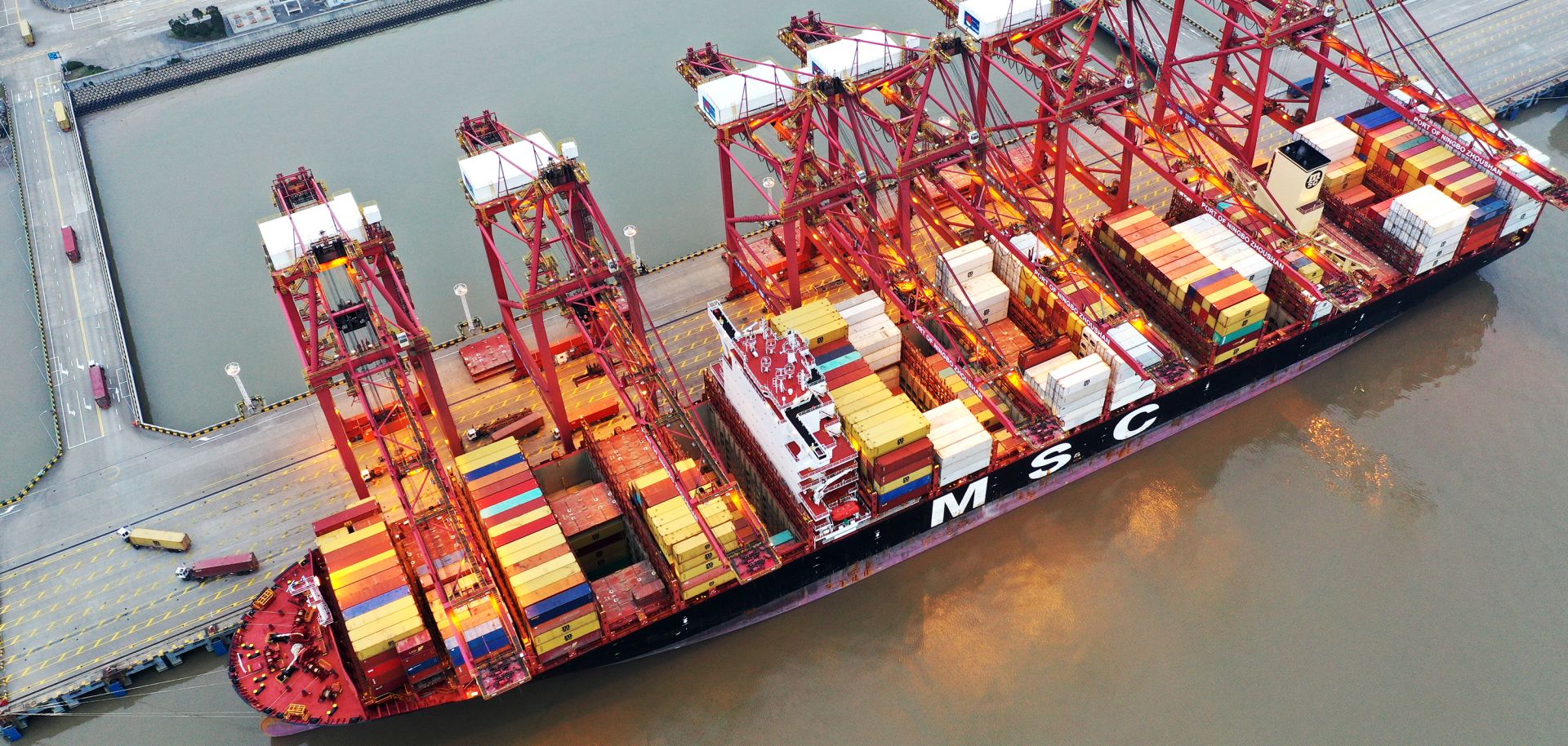 Containers sit stacked on a cargo ship berthed at China’s Zhoushan Port on Feb. 4, 2020. 