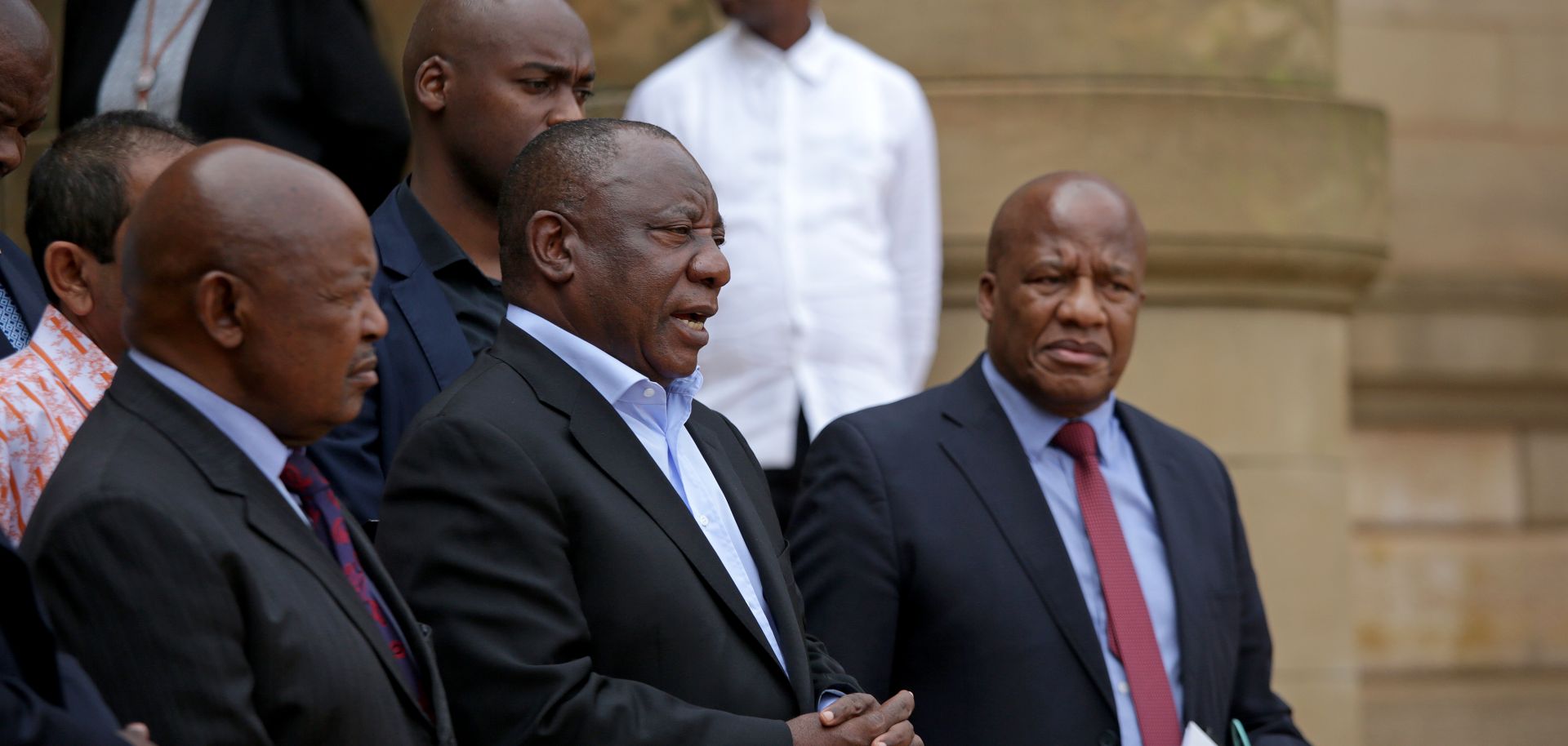 South African President Cyril Ramaphosa (center) addresses the media in Pretoria after concluding a meeting with various business and political leaders on matters relating to the COVID-19 outbreak on March 22, 2020. 