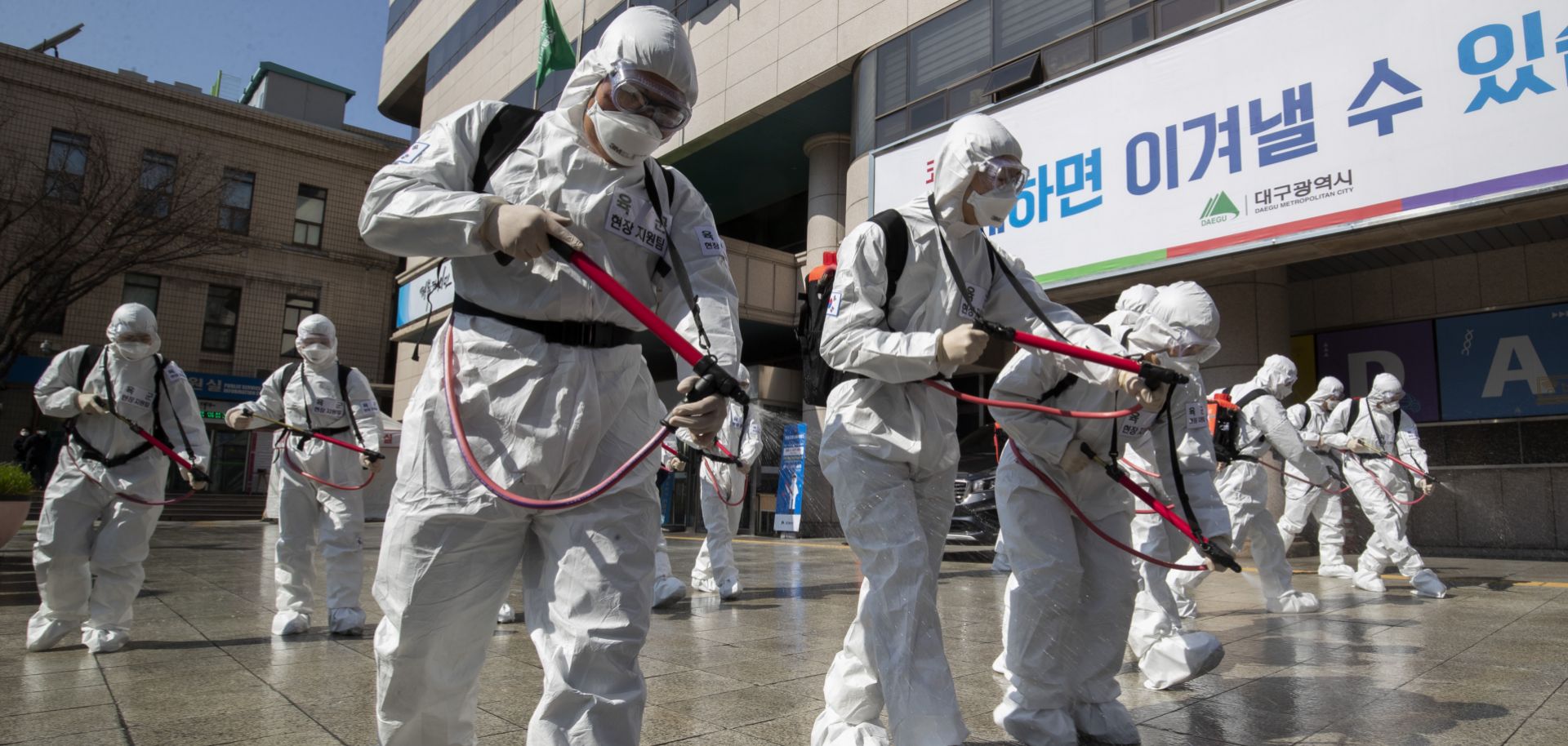 South Korean soldiers in protective suits spray disinfectant on March 2, 2020, in Daegu, South Korea.