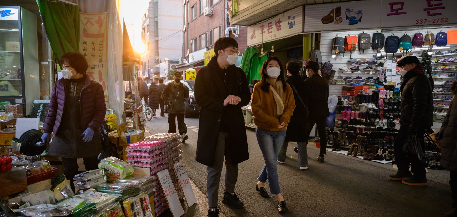 Shoppers wearing face masks amid concerns over the COVID-19 novel coronavirus outbreak in a market in Seoul, South Korea, on March 14, 2020.