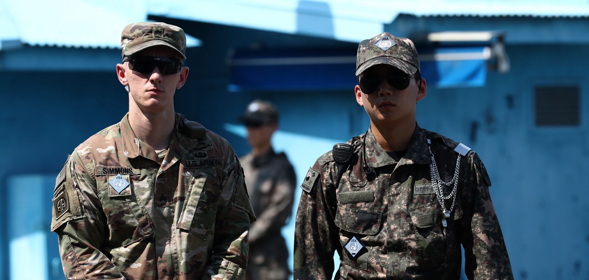 A U.S. soldier (left) stands guard next to a South Korean soldier (right) in Panmunjom, South Korea, on July 27, 2019, during a ceremony commemorating the 66th anniversary of the signing of the Korean War Armistice Agreement.