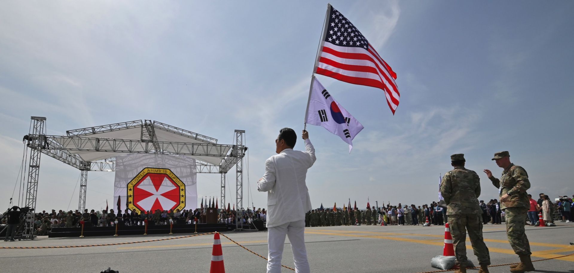 A man waves U.S. and South Korean flags during a ceremony in Pyeongtaek, South Korea, on June 8, 2019. 