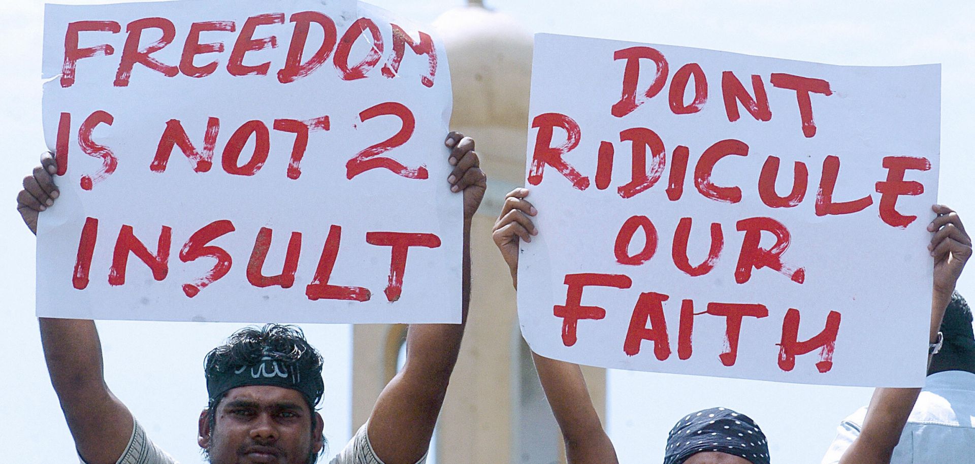 Sri Lankan Muslims pose with placards during a rally.