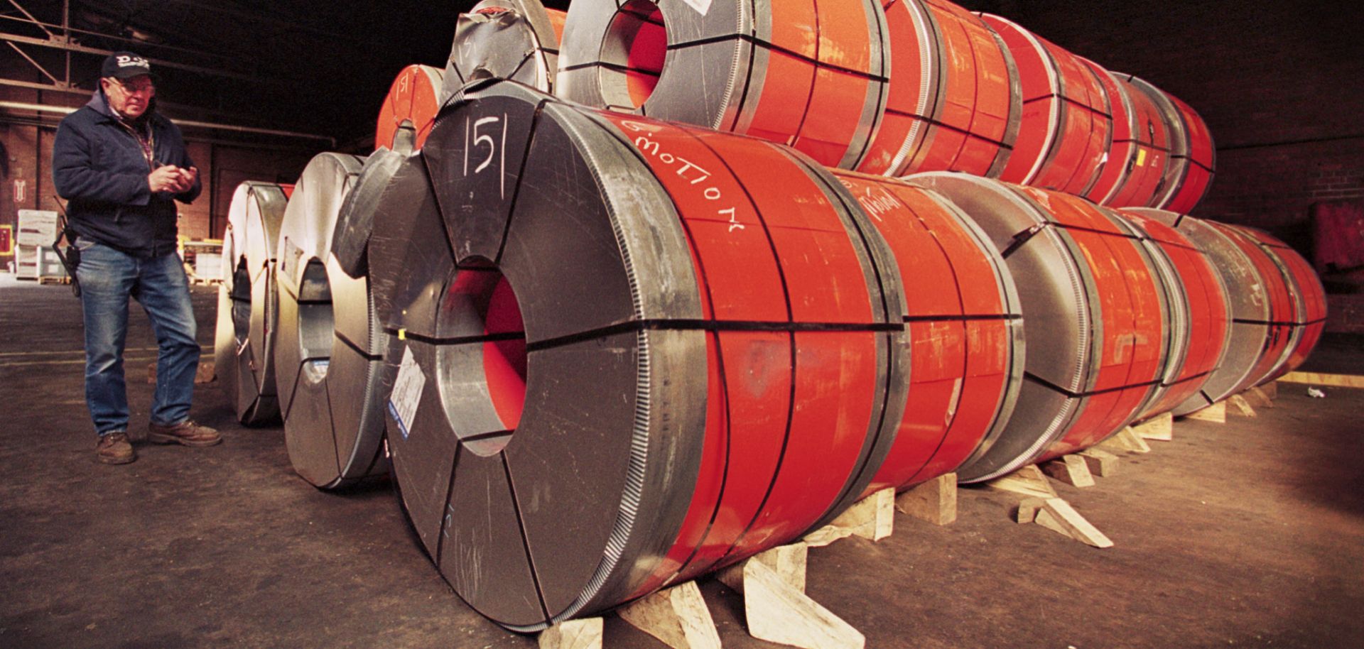 A port employee in Camden, New Jersey, checks the shipping labels on coils of steel imported from France in this 2002 photo.