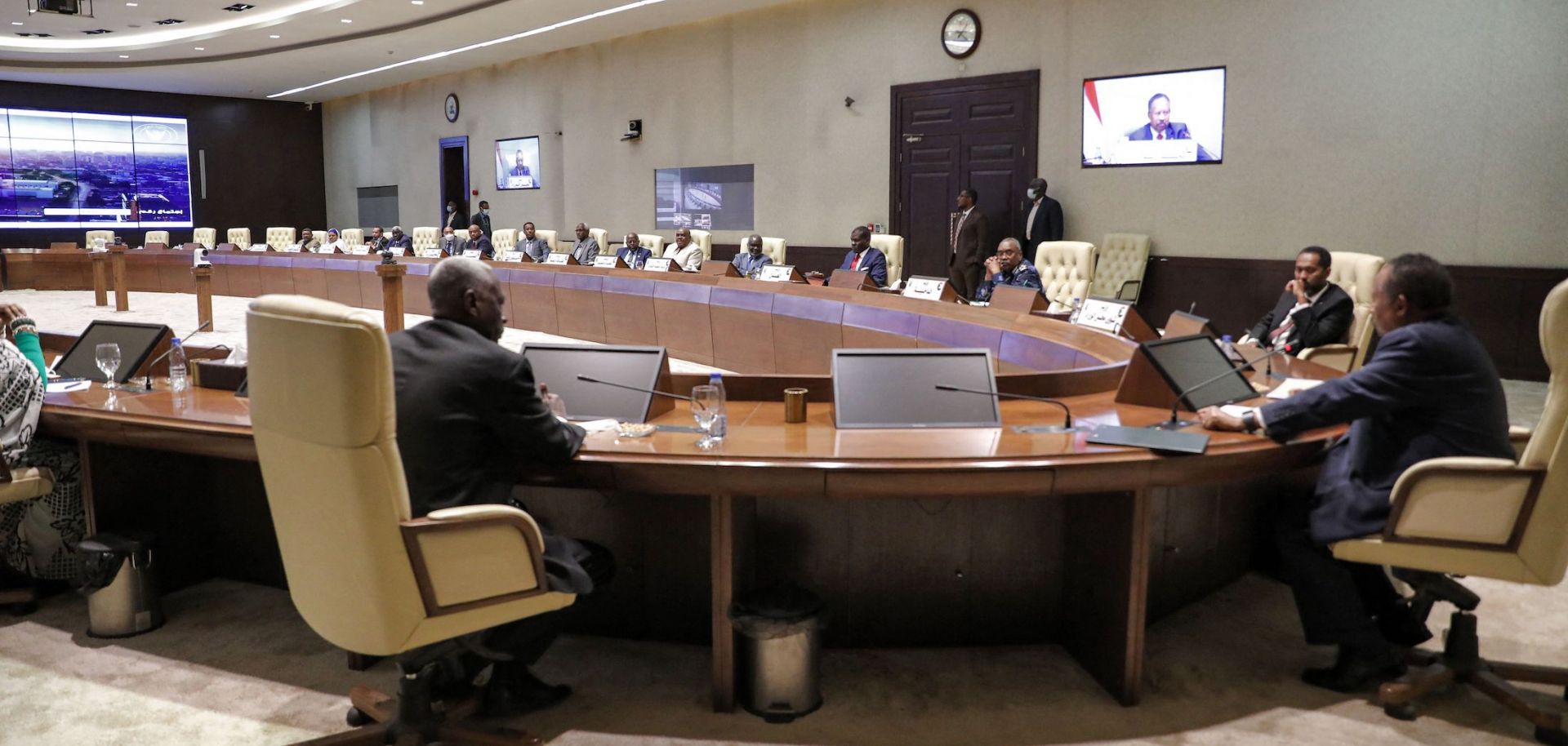 Sudanese Prime Minister Prime Minister Abdalla Hamdok (right) chairs a cabinet meeting in Khartoum on Sept. 21, 2021, in the wake of a failed coup attempt earlier that day. 