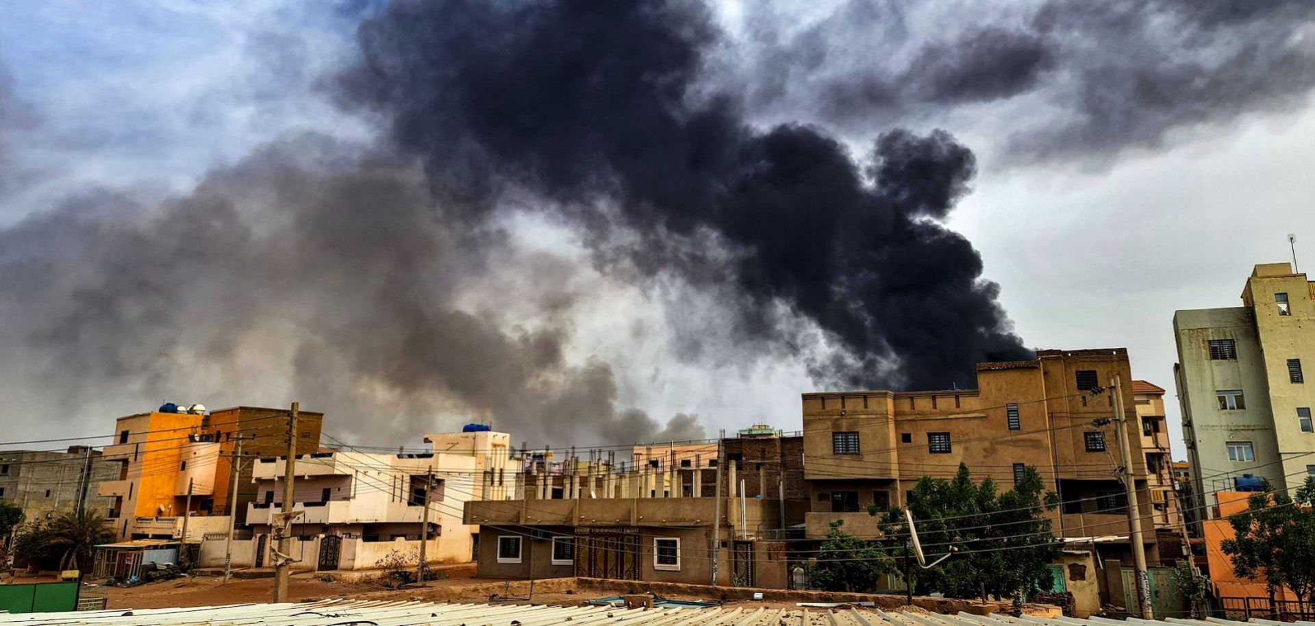 Smoke plumes billow from a fire at a lumber warehouse in southern Khartoum amidst ongoing fighting on June 7, 2023. 