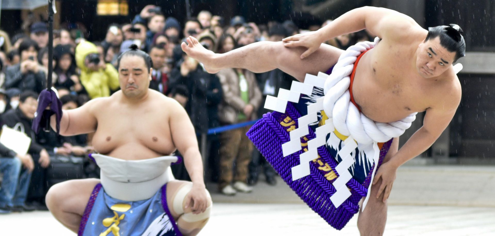 Mongolian-born Harumafuji Kohei (r) is one of only 72 sumo wrestlers in the centuries-old history of the sport to attain the rank of yokozuna, or grand champion.