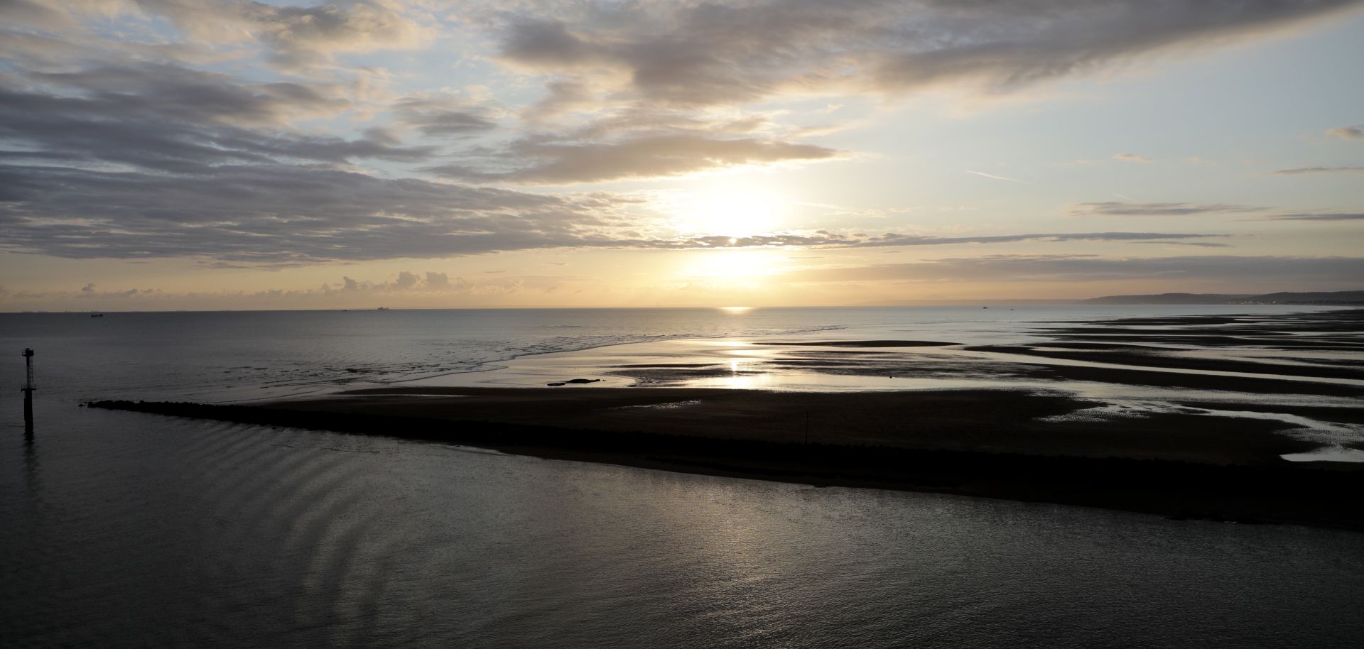 The sun rises over the English Channel.