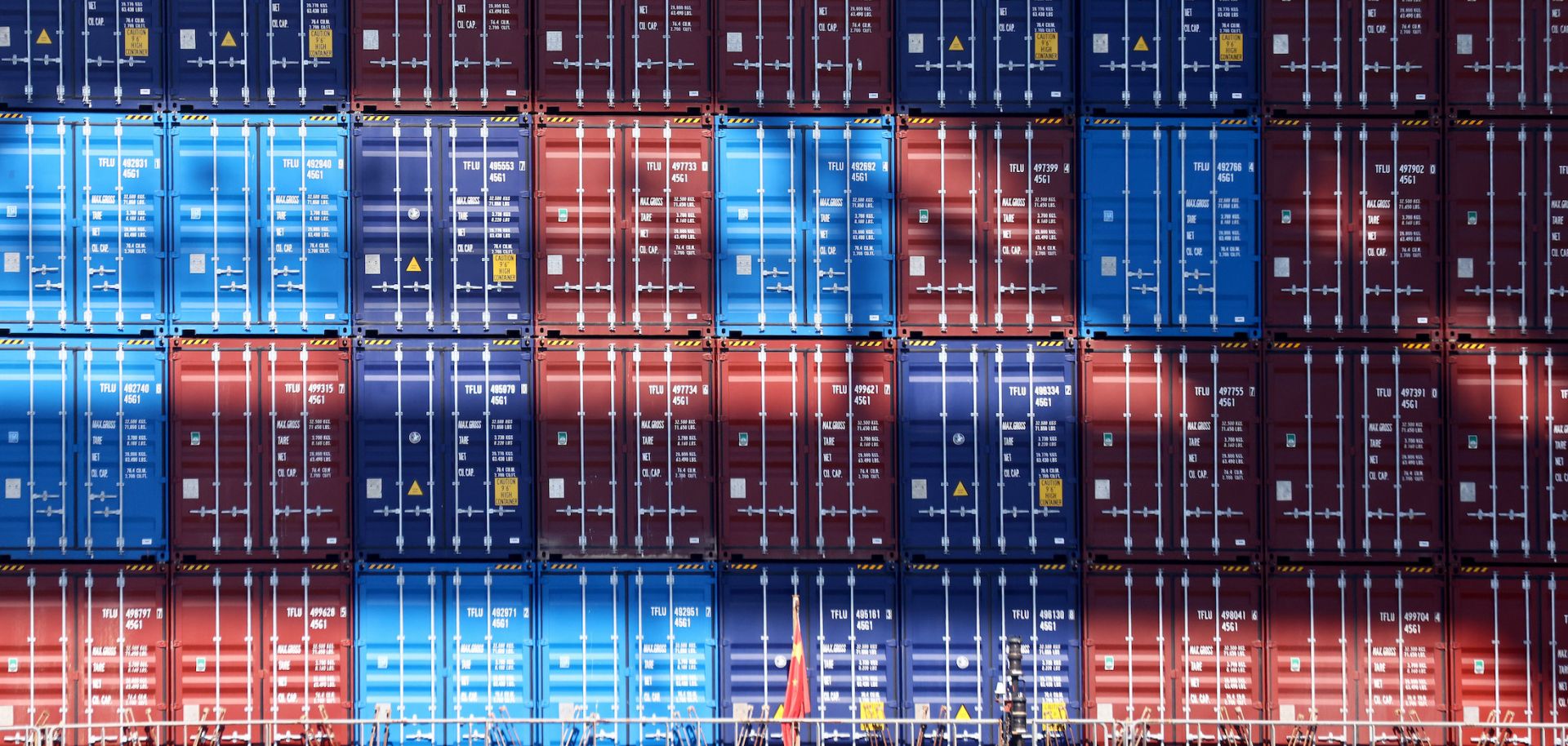A stack of shipping containers at a port