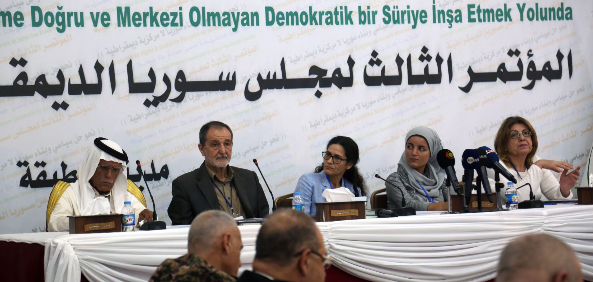 The Syrian Democratic Council, including Kurdish officials and some members of Syria's domestic opposition, gather in the northern town of Tabqa during July 2018.