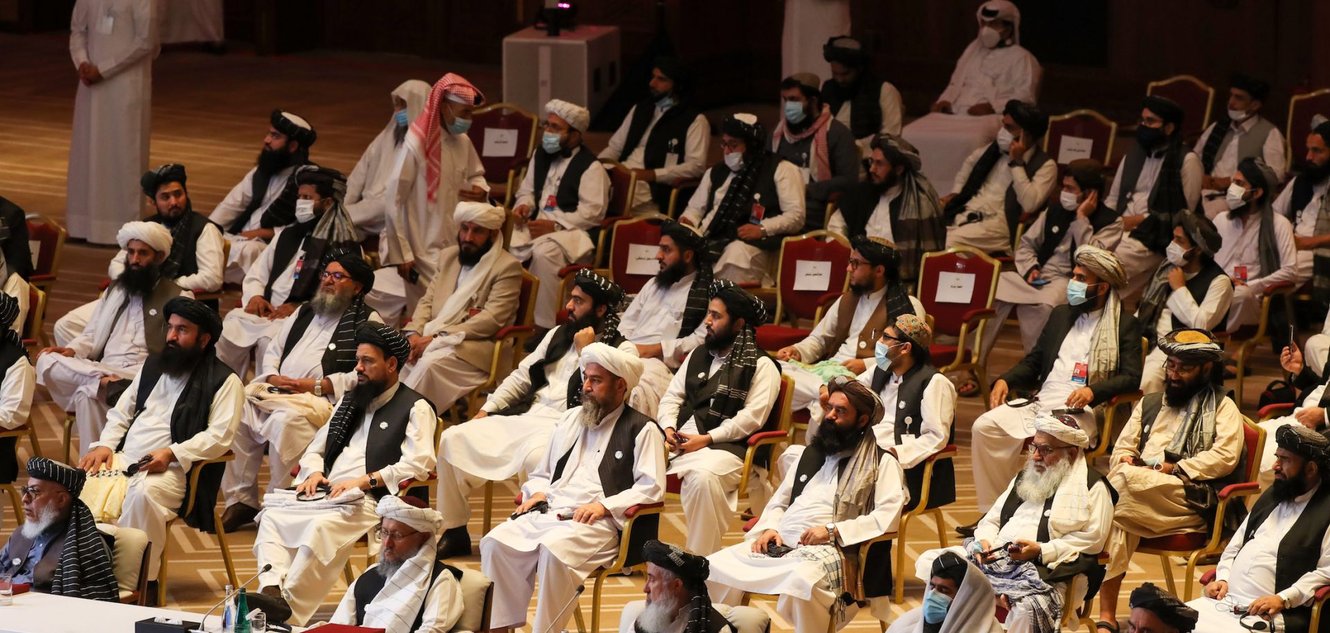 Members of the Taliban delegation attend the opening session of the peace talks