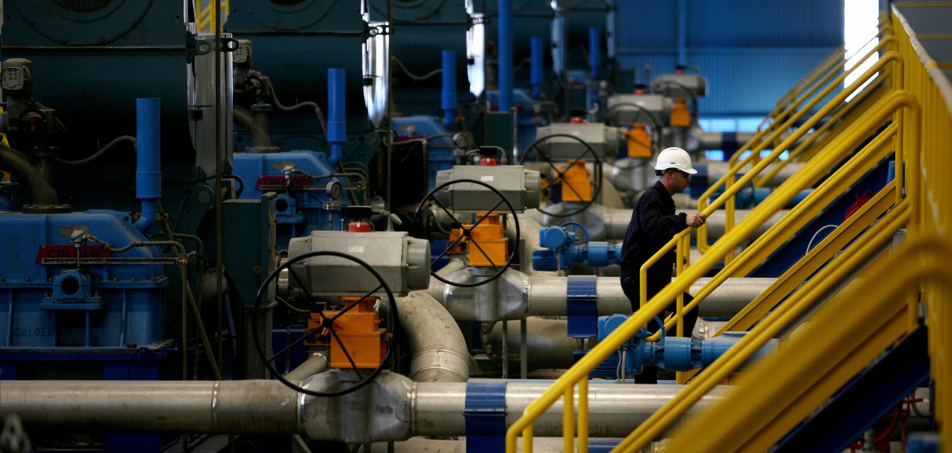 Technicians work at a desalination plant.