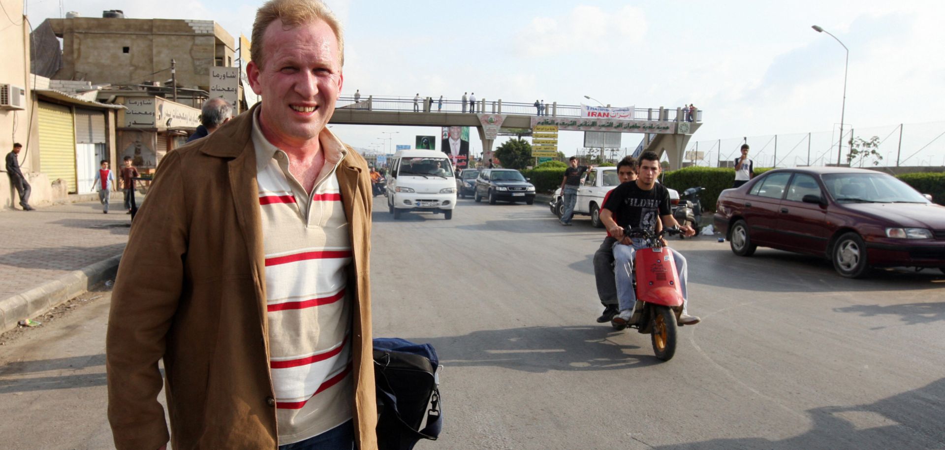 A tourist is a little too obvious as he walks away from Rafik Hariri International Airport in Beirut.