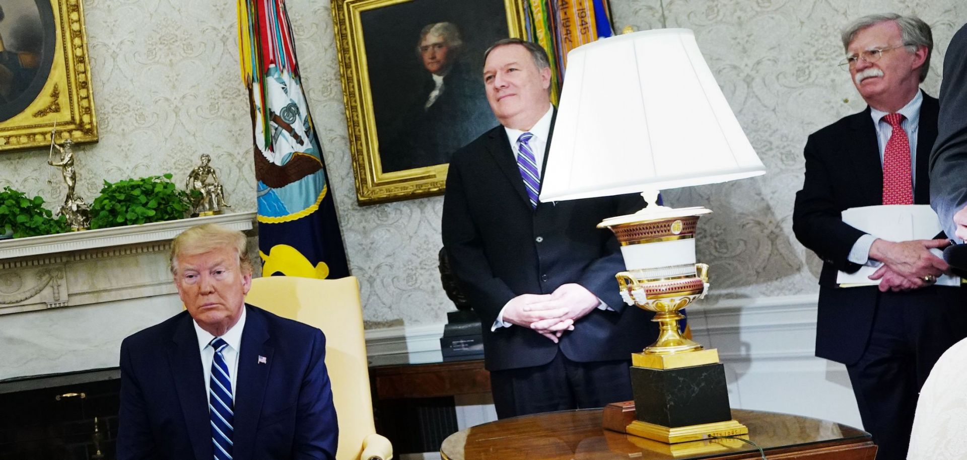 U.S. President Donald Trump, Secretary of State Mike Pompeo and national security adviser John Bolton, left to right, are pictured in the Oval Office of the White House on June 20, 2019.