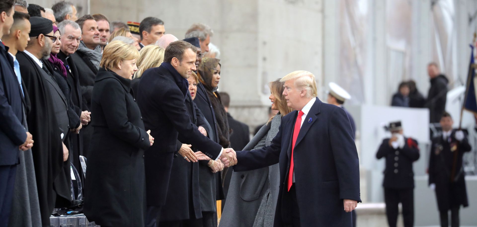 U.S. President Donald Trump greets French President Emmanuel Macron in Paris on Nov. 11, 2018, during commemorations marking the 100th anniversary of the end of World War I.