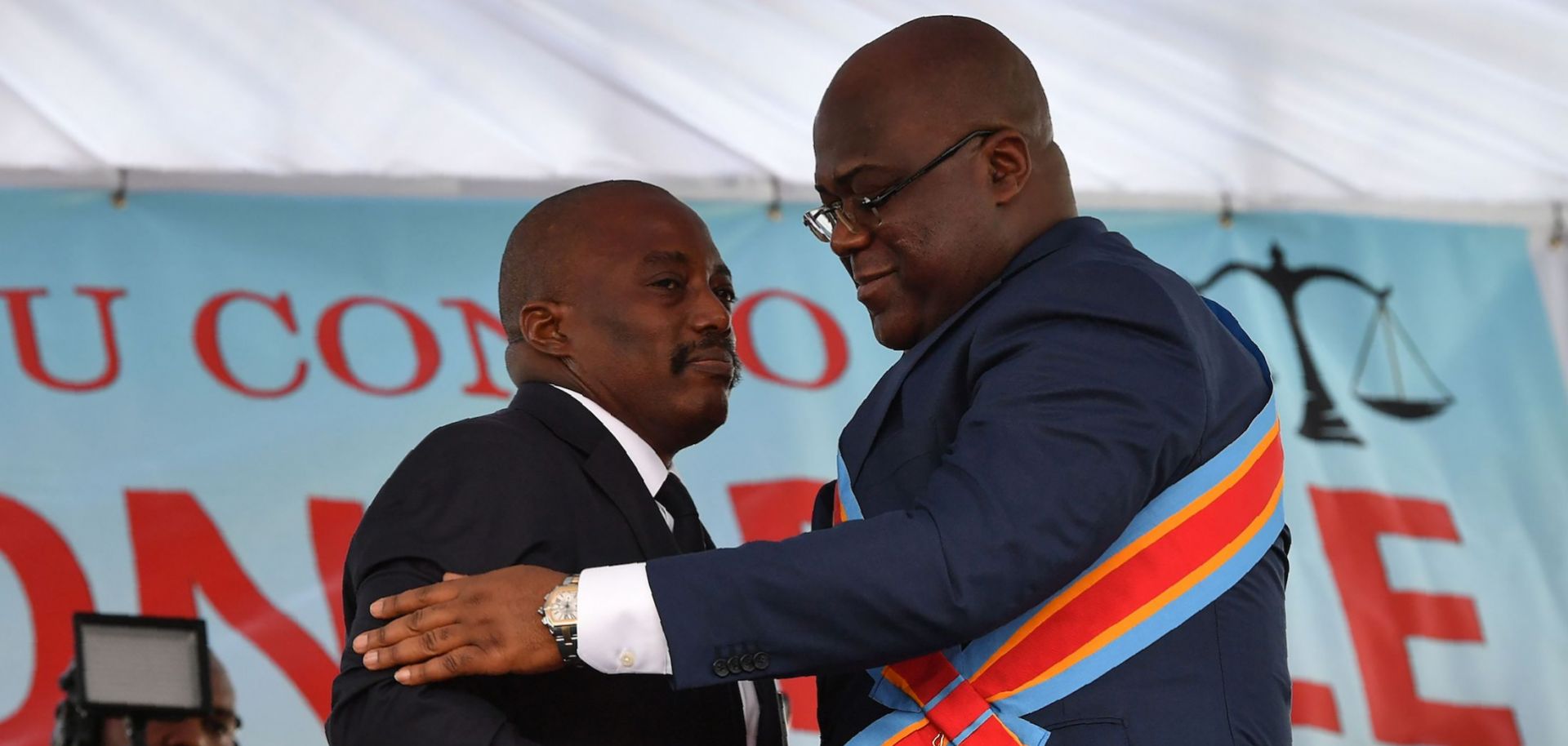 Outgoing Democratic Republic of the Congo President Joseph Kabila (L) embraces newly inaugurated President Felix Tshisekedi on Jan. 24, 2019, in Kinshasa.