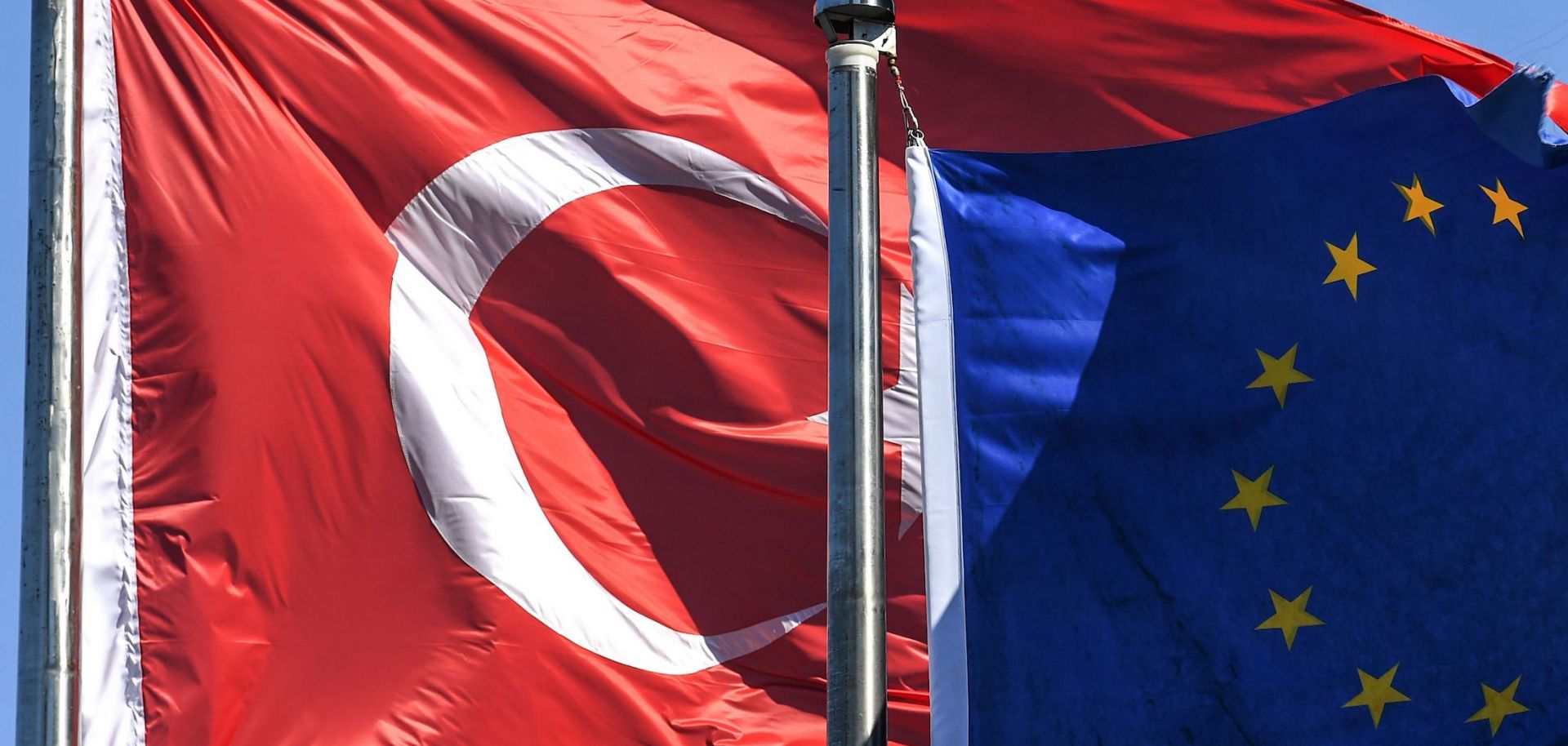 The Turkish and EU flags Aug. 15, 2018, in Istanbul's financial and business district of Maslak.