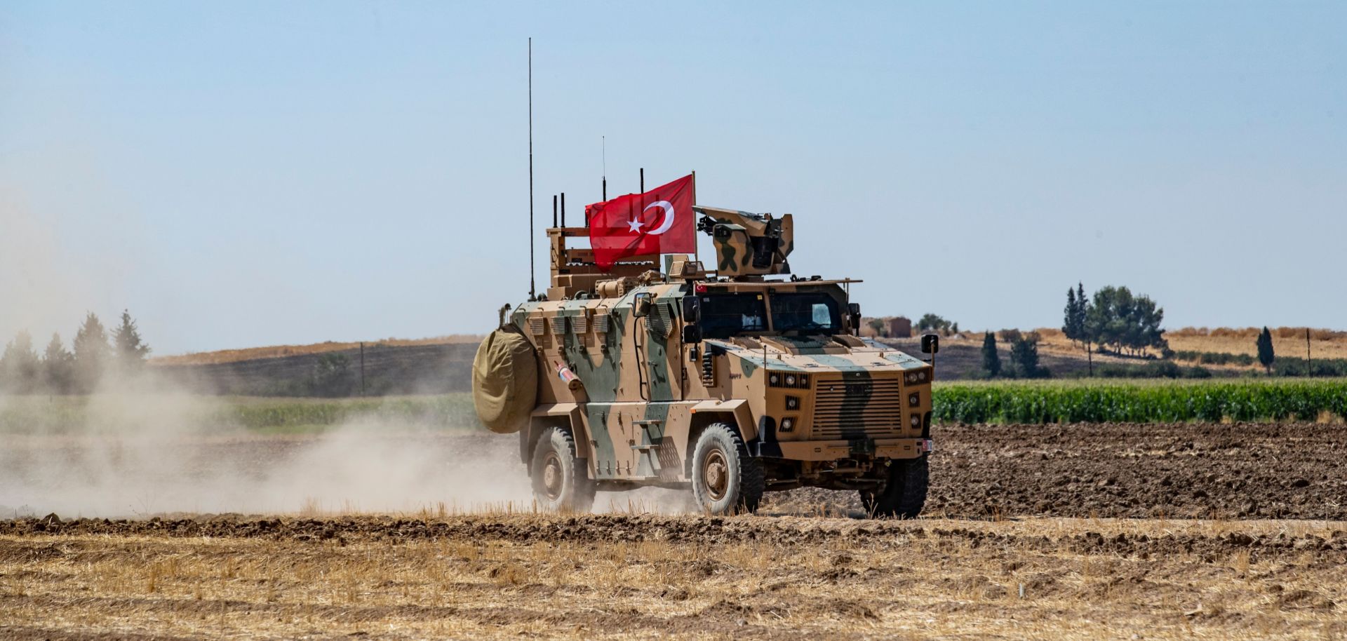 In this photo taken on Sept. 24, 2019, a Turkish military vehicle participates in a joint patrol with the United States near the Syrian border with Turkey. The joint patrols were aimed at easing tensions between Turkey and U.S.-backed Kurdish forces.
