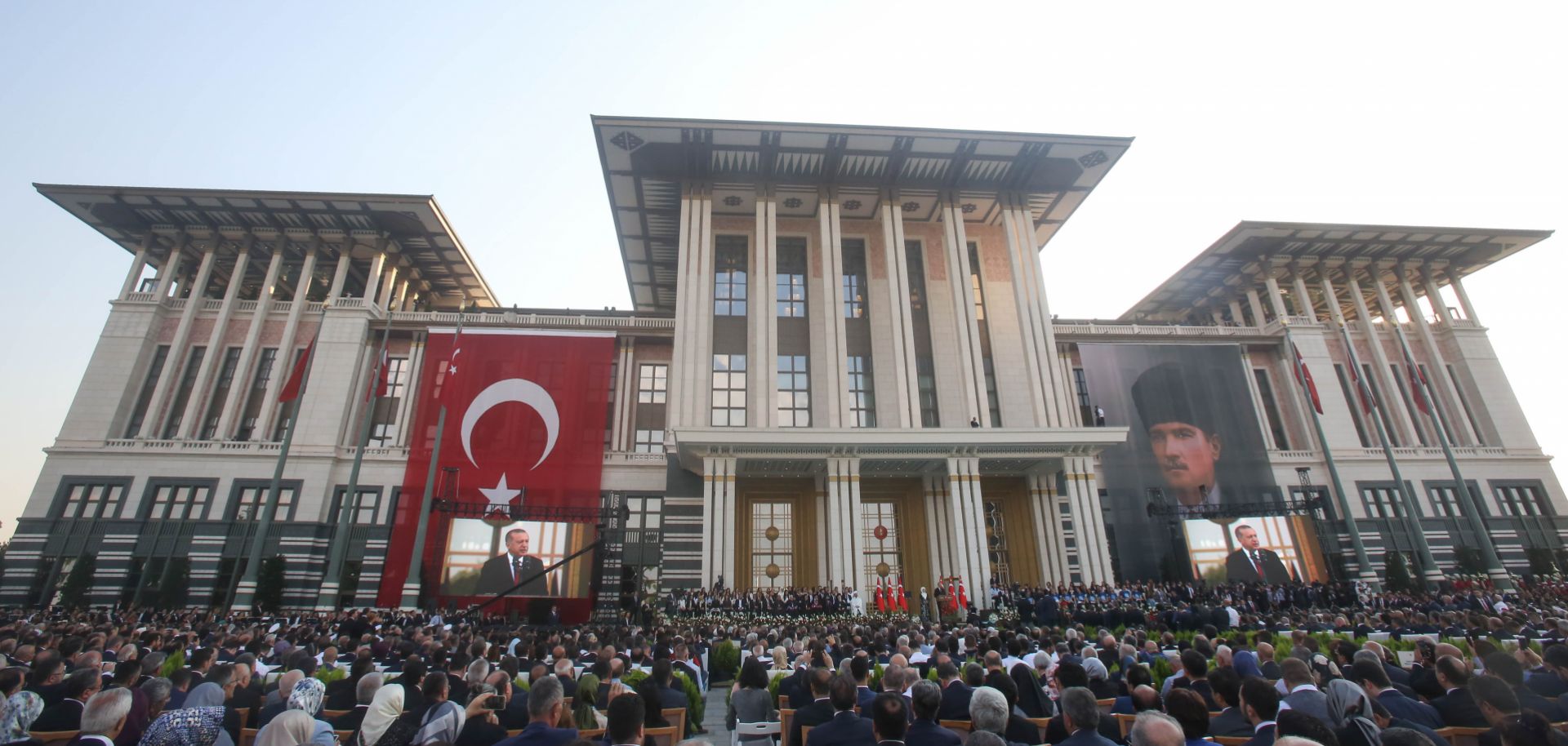 Turkish President Recep Tayyip Erdogan addresses the crowd gathered before Ankara's Presidential Palace on July 9, 2018, the day of his inauguration for another term in office. 