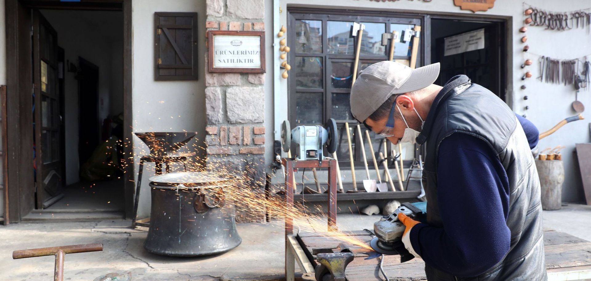 A blacksmith crafts metal in a village mansion in Ankara, Turkey, on Nov. 18, 2020. 