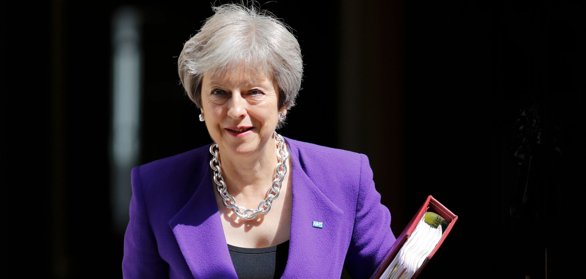 British Prime Minister Theresa May leaves 10 Downing Street on July 4 ahead of a session in the House of Commons. 