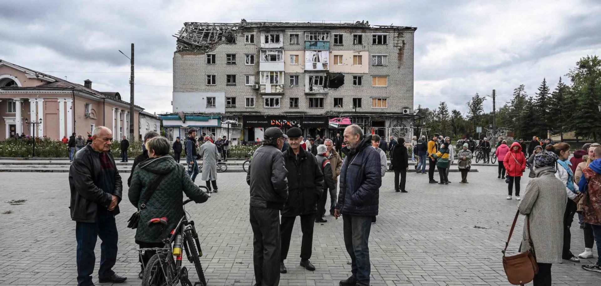 Local residents gather on a square in Izyum, eastern Ukraine, on Sept. 14, 2022. 