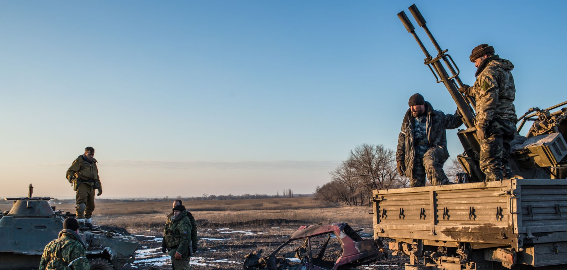A picture shows a group of pro-Russia Cossack rebel fighters organize equipment, some of which was captured from the Ukrainian Army, on Feb. 20, 2015 in Debaltseve, Ukraine. 