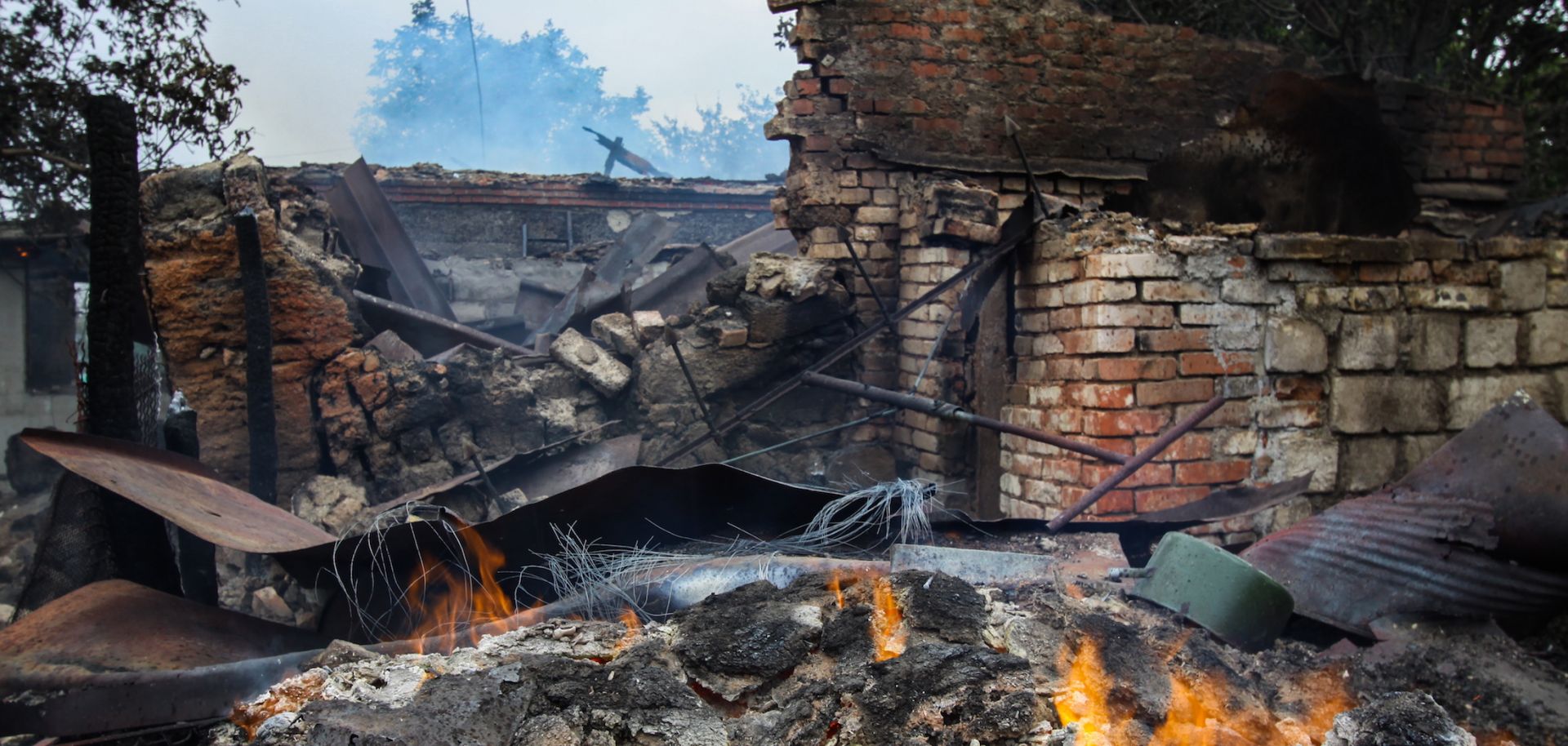 A house in the village of Roza in eastern Ukraine is left burning after fighting between Ukrainian forces and Russian separatists on Sept. 6, 2019.