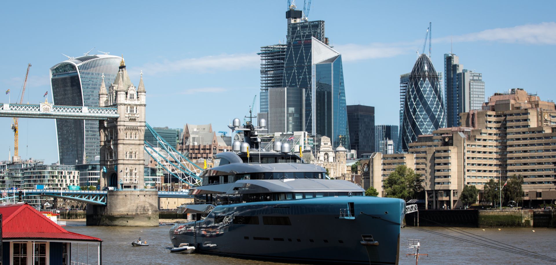 Billionaire Joe Lewis' nearly 100-meter luxury yacht floats in Butler's Wharf in London in July 2018.