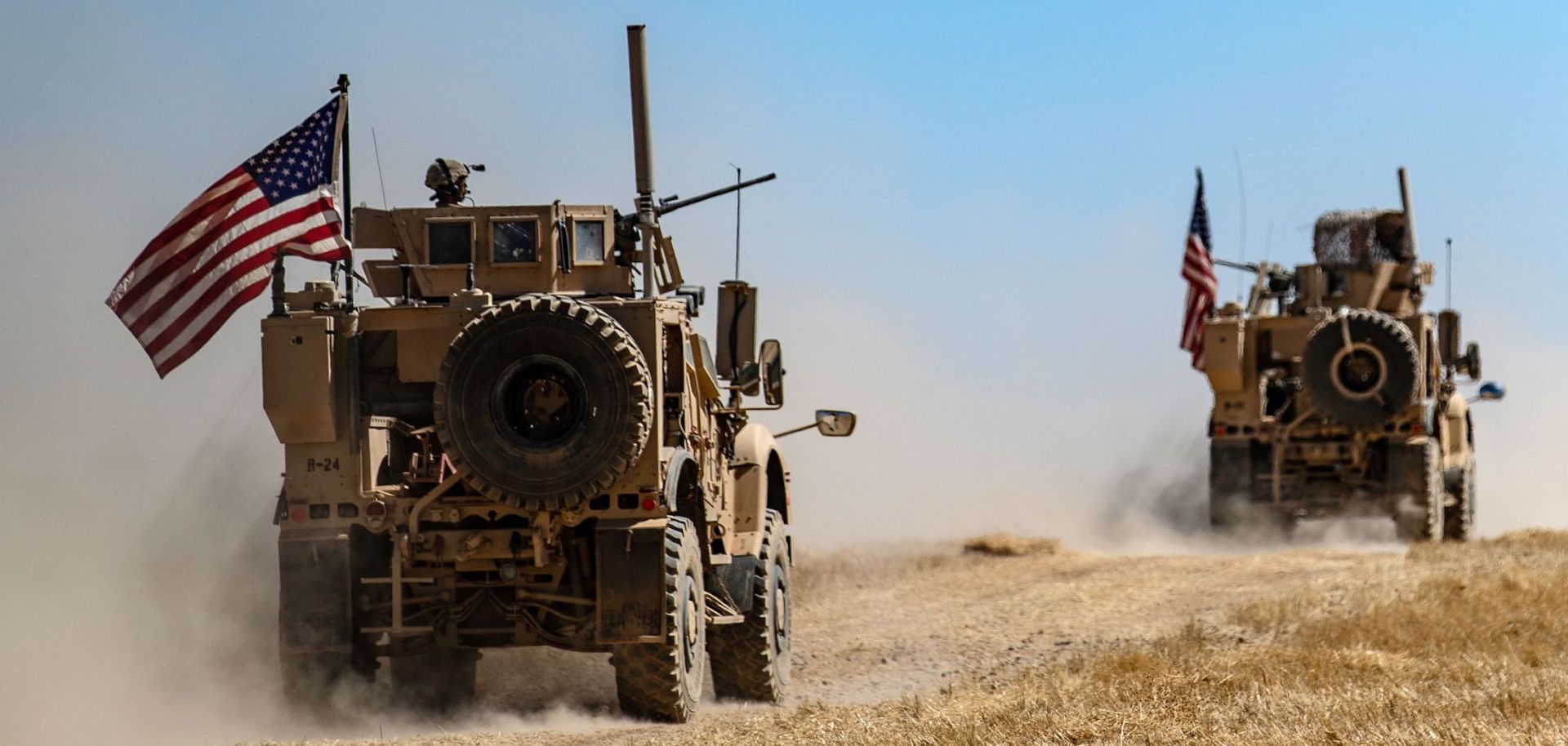 A U.S. military convoy patrols a Syrian village along the Turkish border on Sept. 8, 2019.