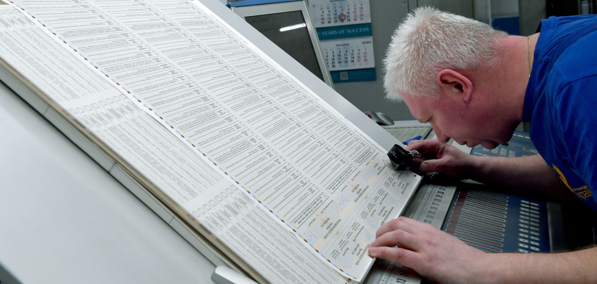 An employee of a printing plant in Kiev, Ukraine, checks ballots on March 21, 2019. Ukrainians choose their next president on March 31.