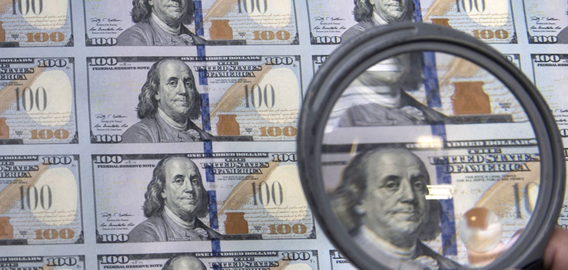 A fresh sheet of $100 bills at the U.S. Bureau of Engraving and Printing's Western Currency Facility in Fort Worth, Texas. The budget has taken center stage in recent presidential debates.