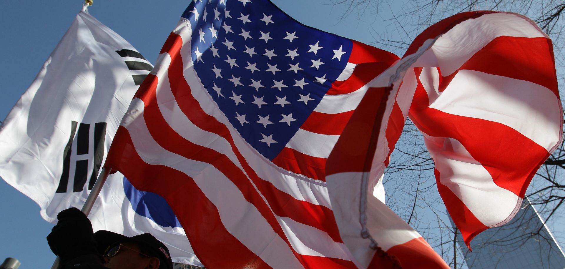 U.S. and South Korean flags are waved March 10, 2015, in Seoul, South Korea.
