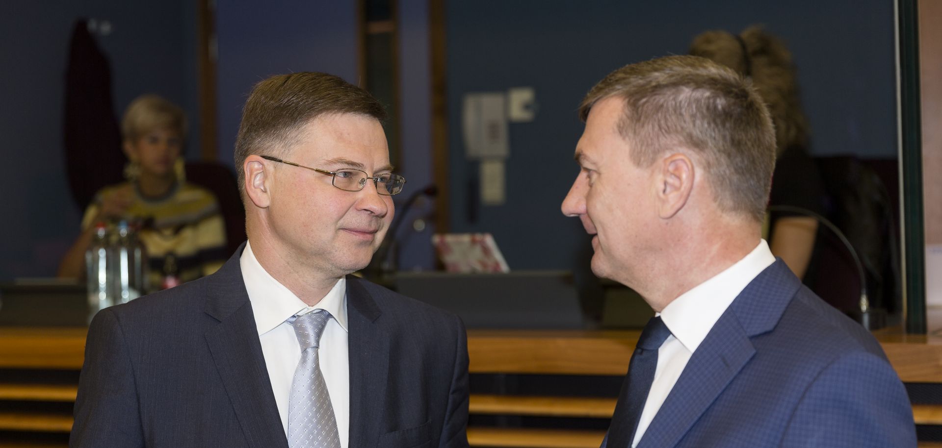 EU Euro & Social Dialogue Commissioner Valdis Dombrovskis is talking with the EU Digital Single Market Commissioner Andrus Ansip.