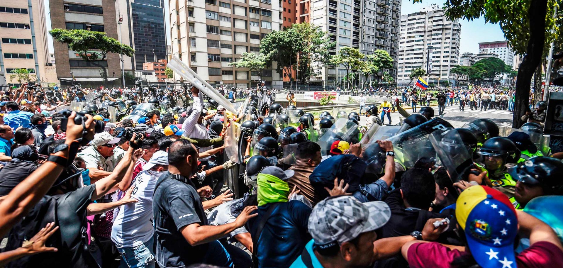 A default by Petroleos de Venezuela on its debt would likely hamper oil production, leading to tighter food supplies and stirring up further unrest in Venezuela.