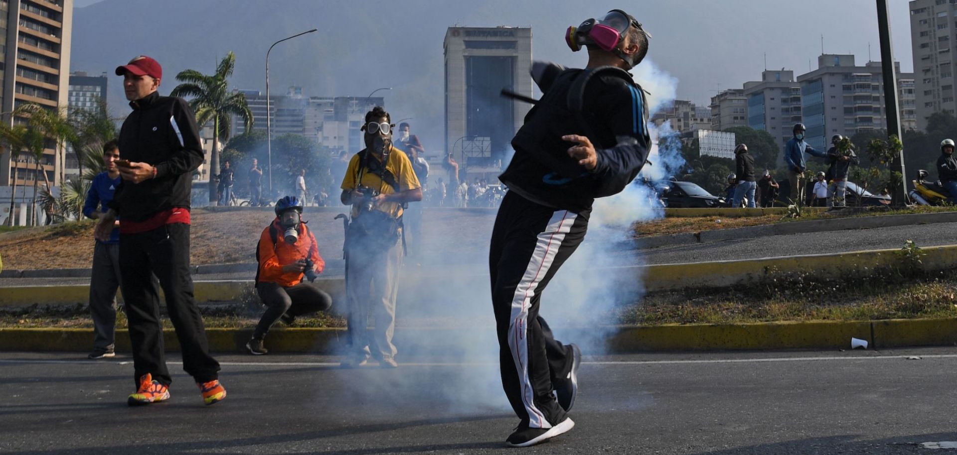 Opposition supporters clash with Venezuelan security forces in Caracas on April 30, 2019.