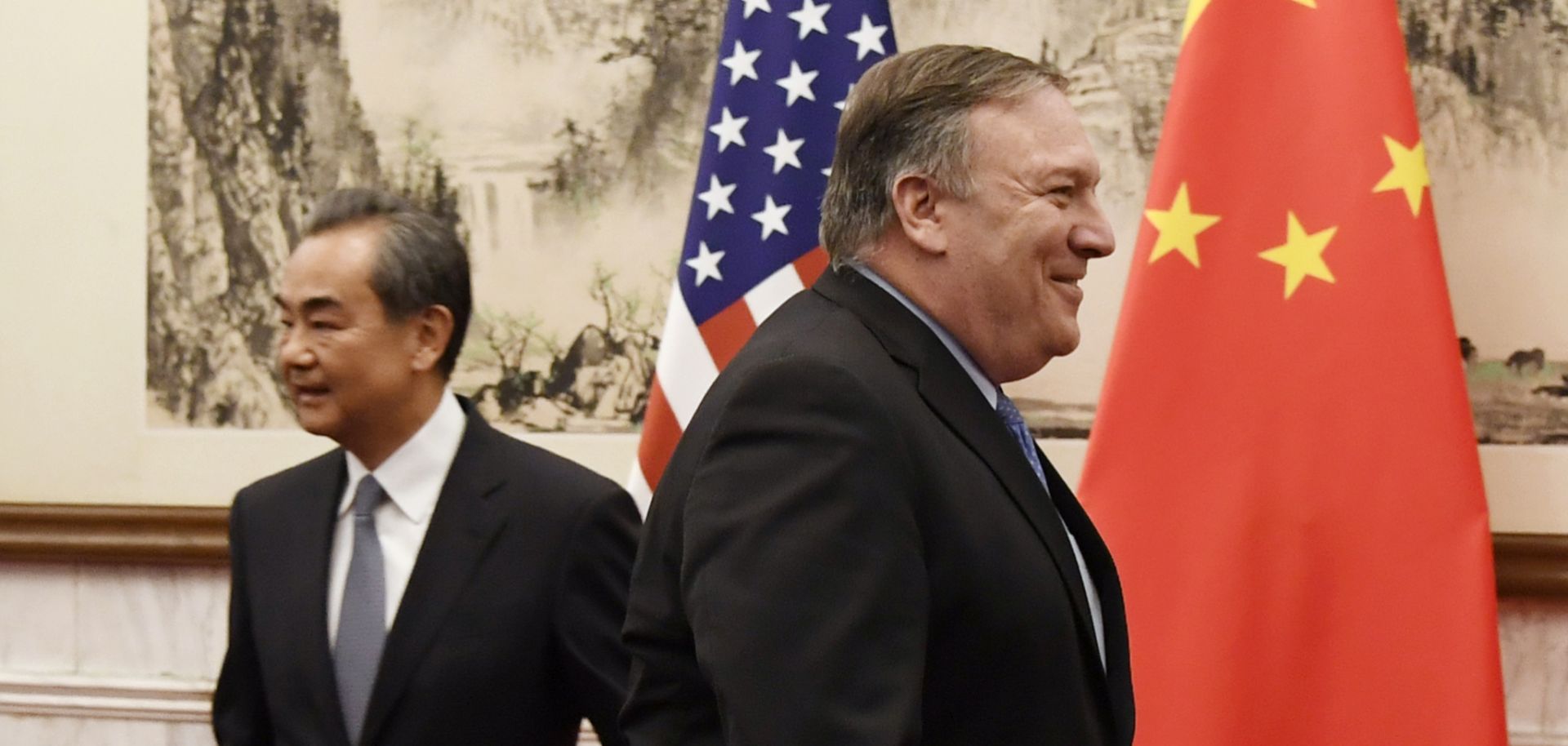 Chinese Foreign Minister Wang Yi (L) greets U.S. Secretary of State Mike Pompeo (R) prior to a meeting at the Diaoyutai State Guesthouse on Monday, Oct. 8, in Beijing, China.