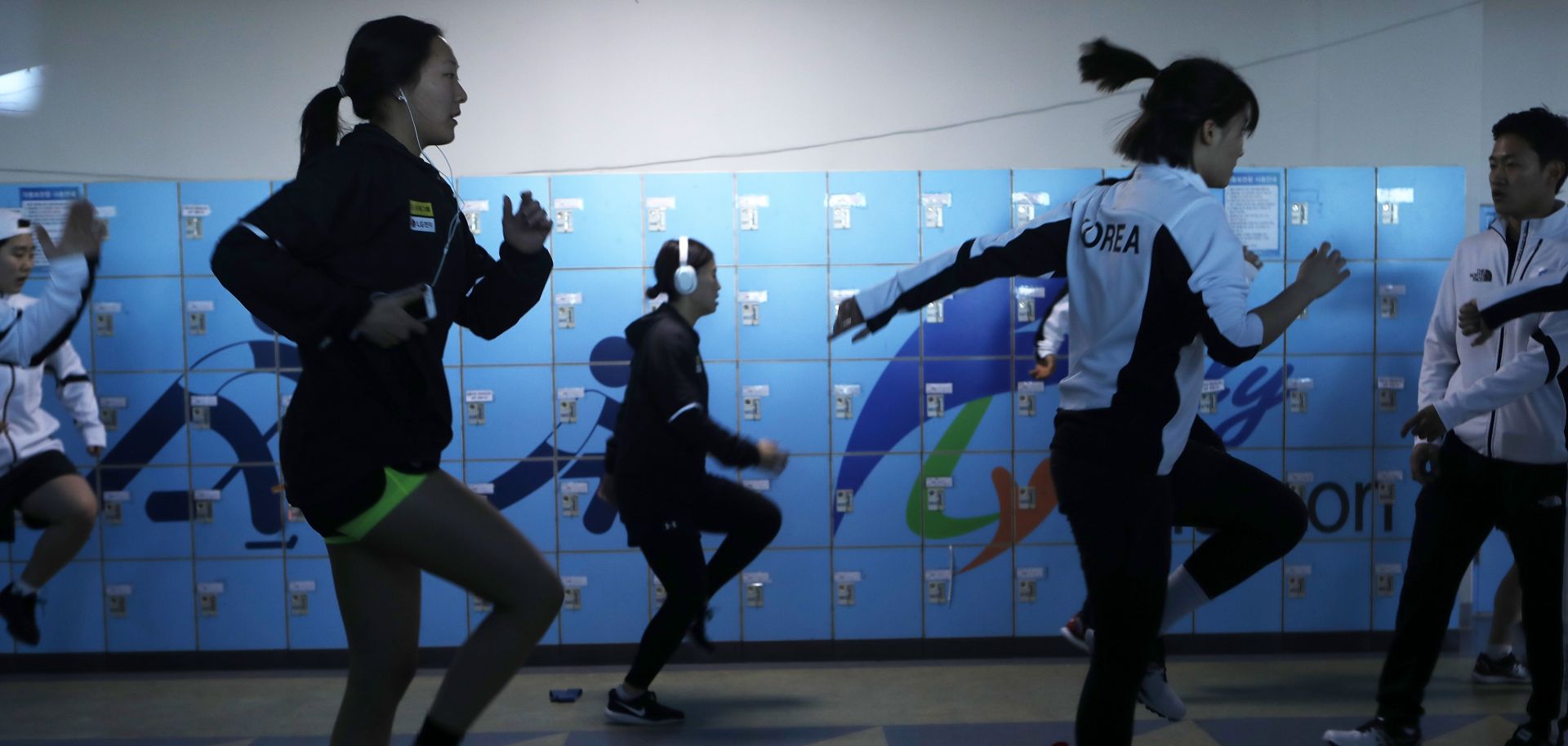 Members of the Korean women's ice hockey team warms up before a match days before the 2018 Winter Olympics, where they will compete as a unified team for the first time in Olympic history. 