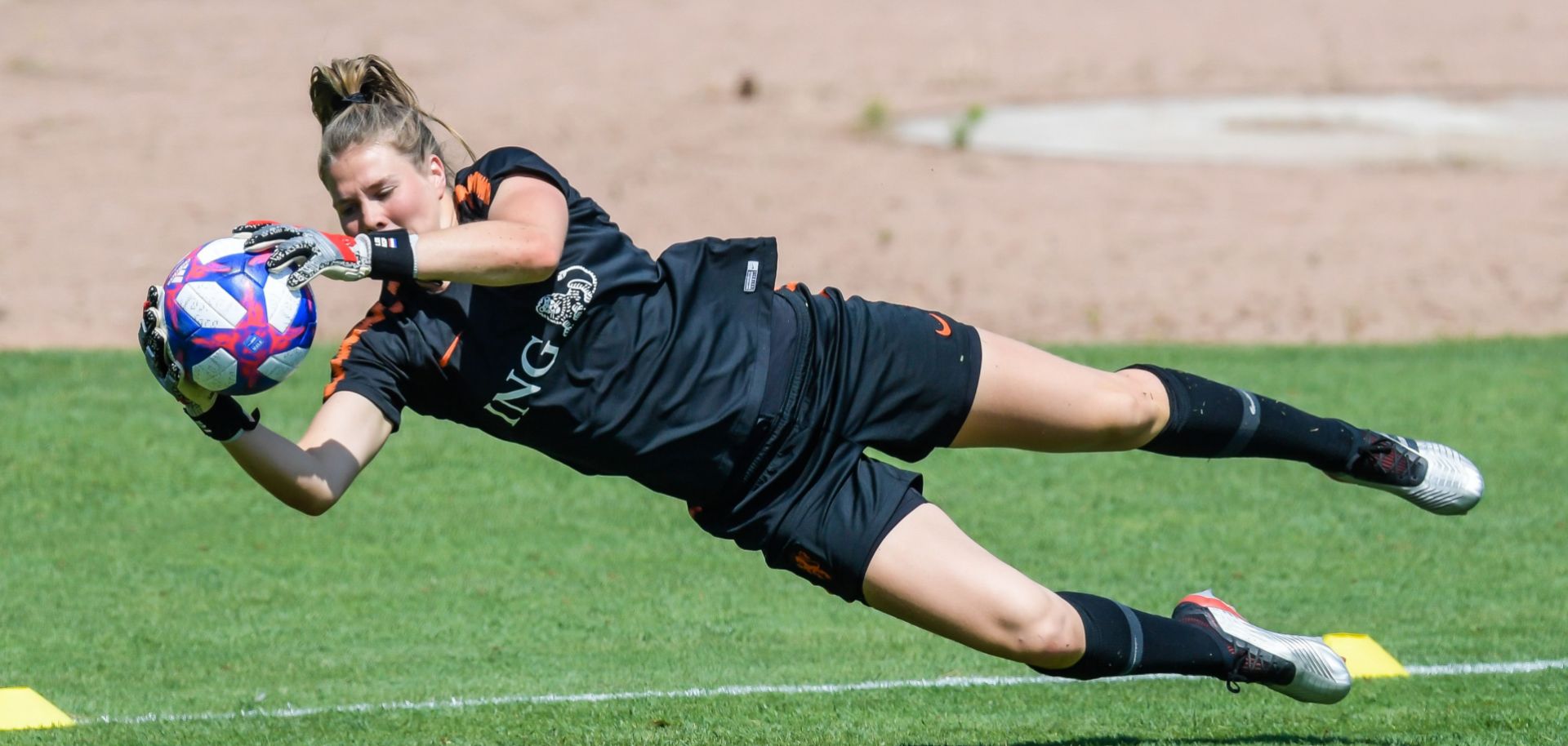 Netherlands goalkeeper Lize Kop works out before her team's appearance in the Women's World Cup championship game