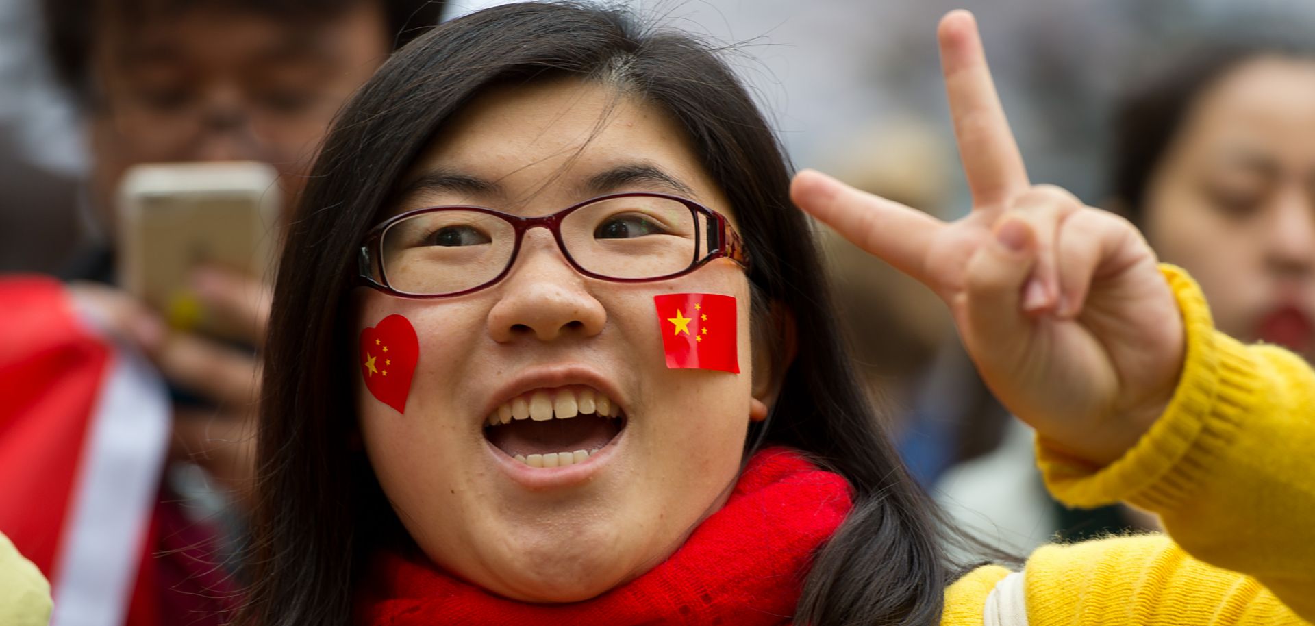 A demonstrator shows support for the Chinese government at a counterprotest held in response to an Amnesty International demonstration over human rights abuses and online censorship in China.