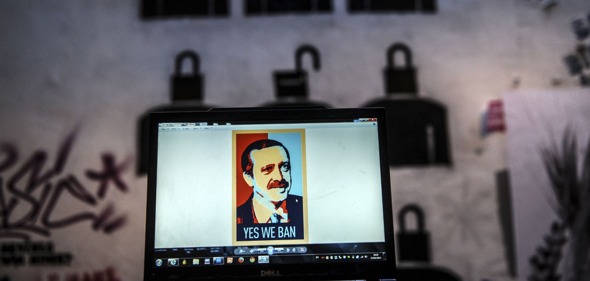 A laptop screen in Istanbul shows an image of Turkish President Recep Tayyip Erdogan emblazoned with the slogan "Yes We Ban," a play on former U.S. President Barack Obama's campaign iconography.