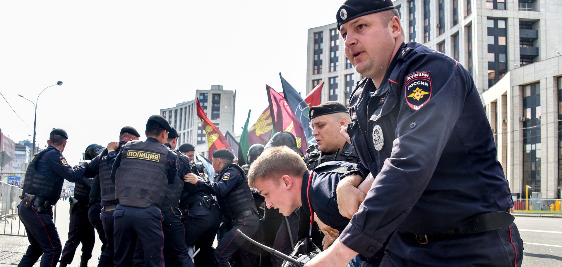 Russian riot police restrain a protester at a demonstration in Moscow in May over the Kremlin's decision to ban the messaging app Telegram.