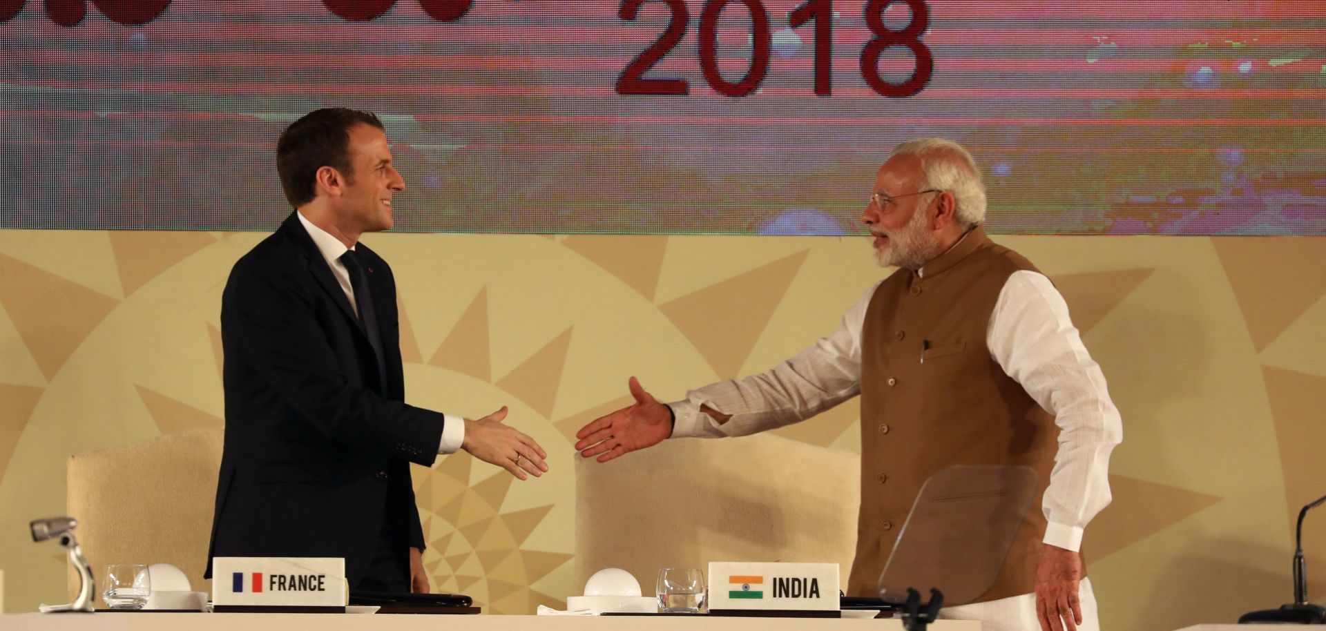 French President Emmanuel Macron, left, and Indian Prime Minister Narendra Modi shake hands at the first conference of the International Solar Alliance, a cooperative effort their countries launched in 2015.