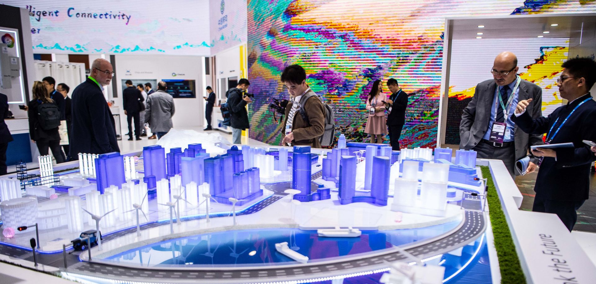 Visitors check out a Chinese exhibit at the GSMA Mobile World Congress in Barcelona, Spain, on Feb. 26, 2019.