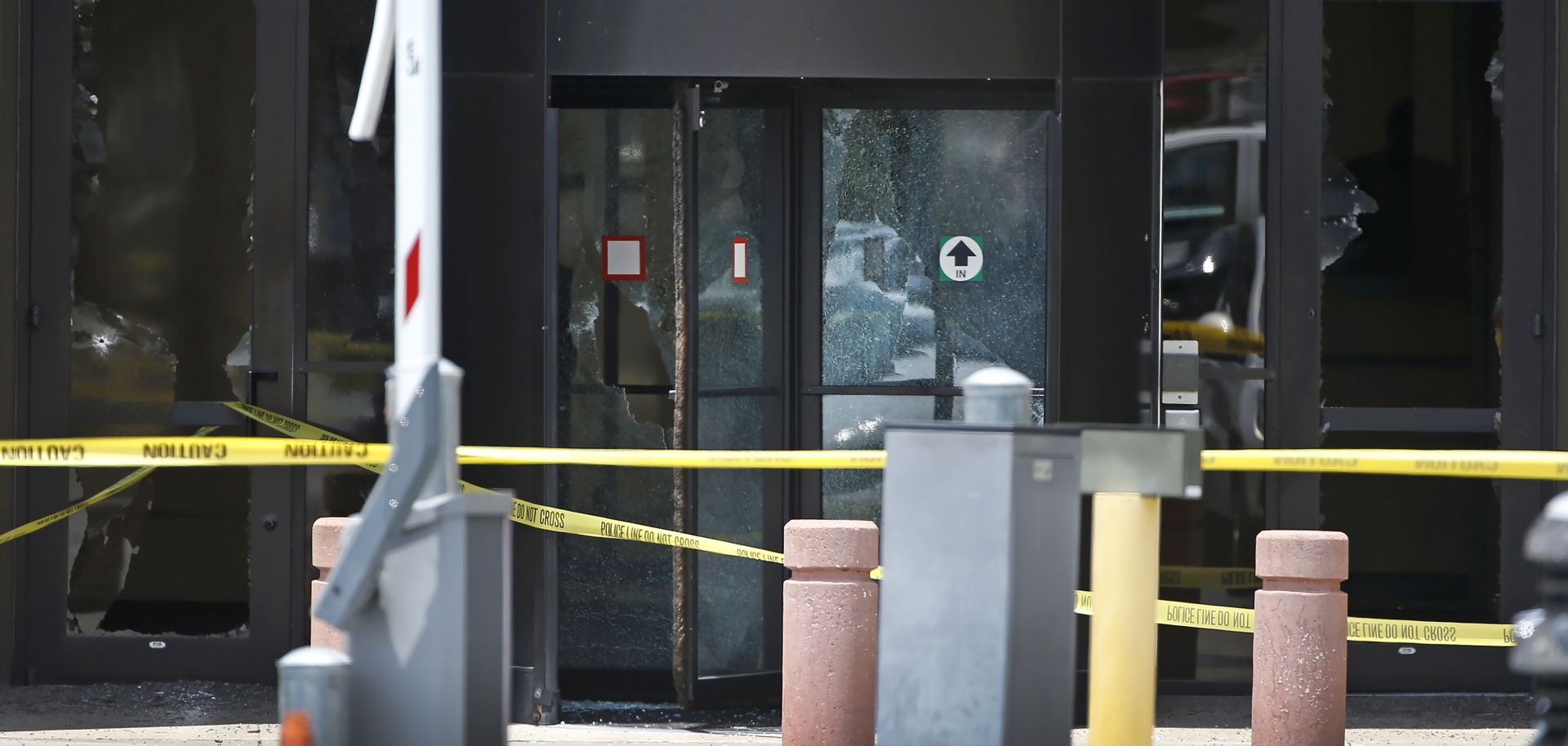 Shattered doors at the Earle Cabell Federal Building in Dallas, Texas, show evidence of a shooting committed by a lone gunman on June 17, 2019. The attacker was killed by police.