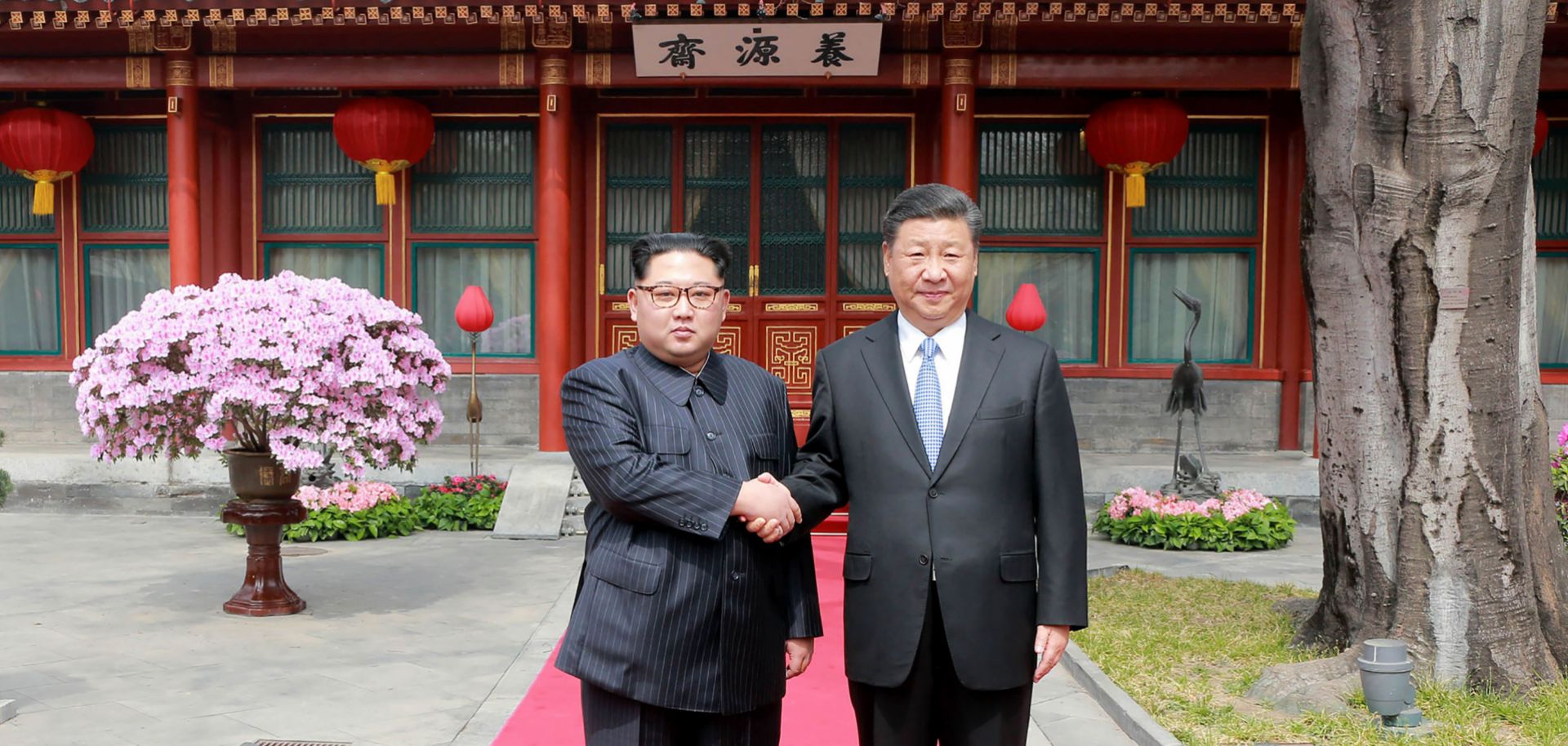 North Korea's state news agency took this photograph, released March 28, 2018, of North Korean leader Kim Jong Un (L) meeting in Beijing with Chinese President Xi Jinping.