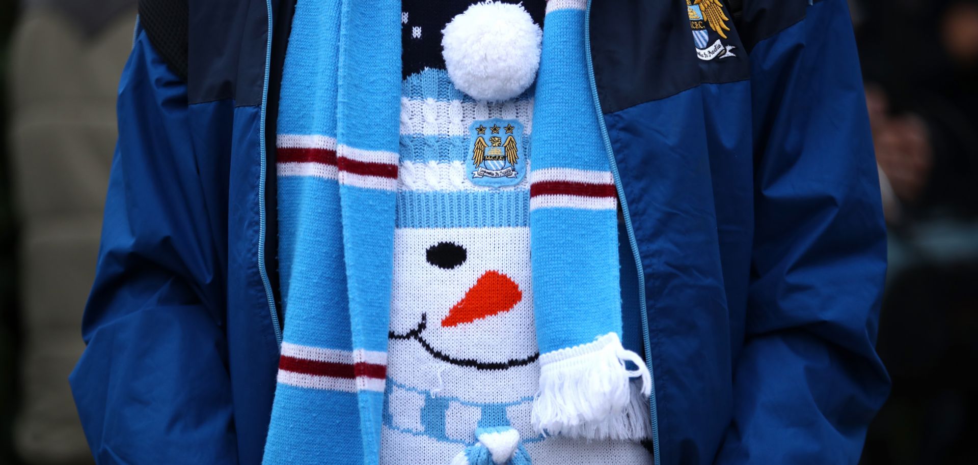 A fan of the Manchester City squad of the English Premier League shows off his festive spirit before a home match in December.