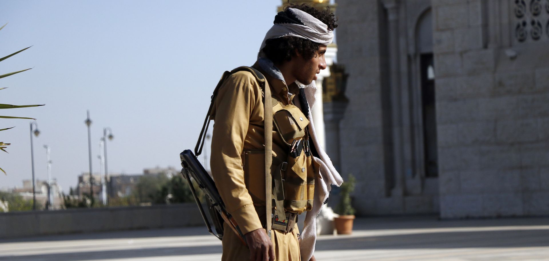 A Houthi fighter stands outside at a funeral for rebels killed in Marib, Yemen, on Feb. 28, 2021. 